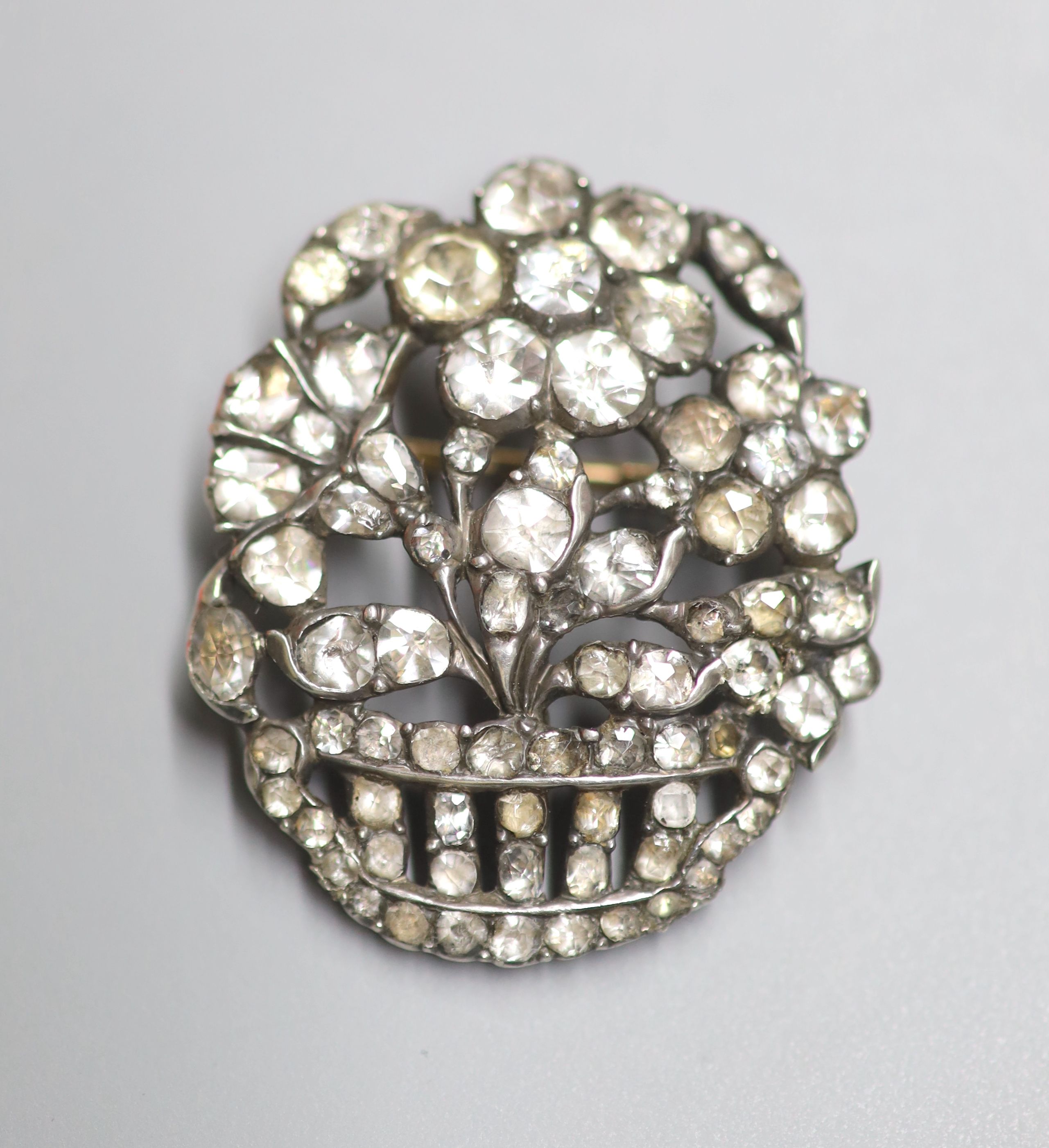 A white metal and paste set giardinetto brooch, 33mm.